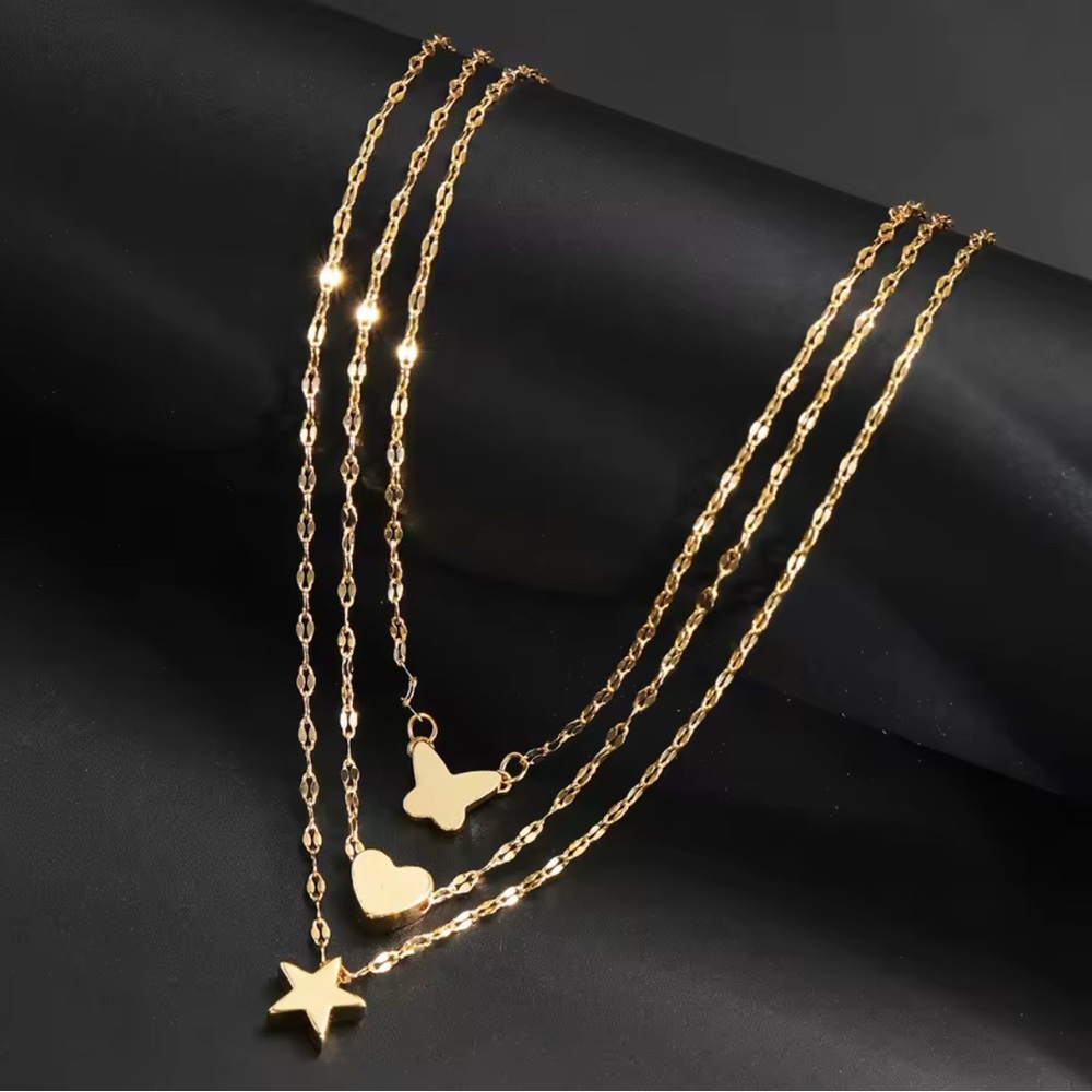 Gold Layered Necklace with Star, Heart, and Butterfly Charms